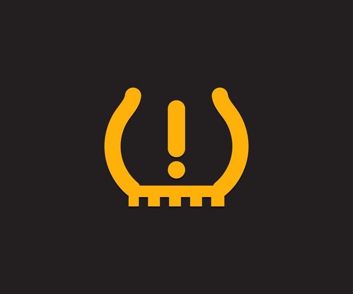 TPMS warning light indicator on dashboard requiring tire pressure check